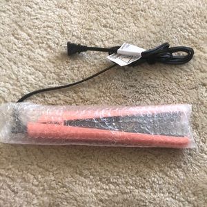 Amika hair straightener. New in packaging, never used